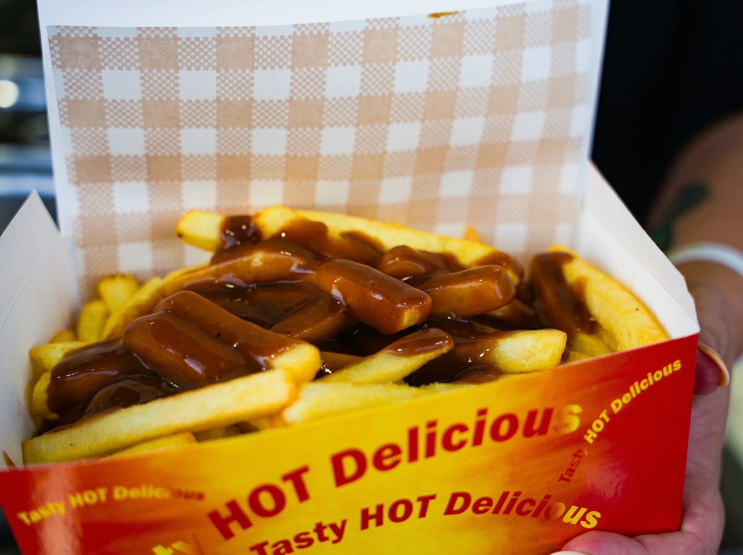 Hot chips with gravy in the branded box