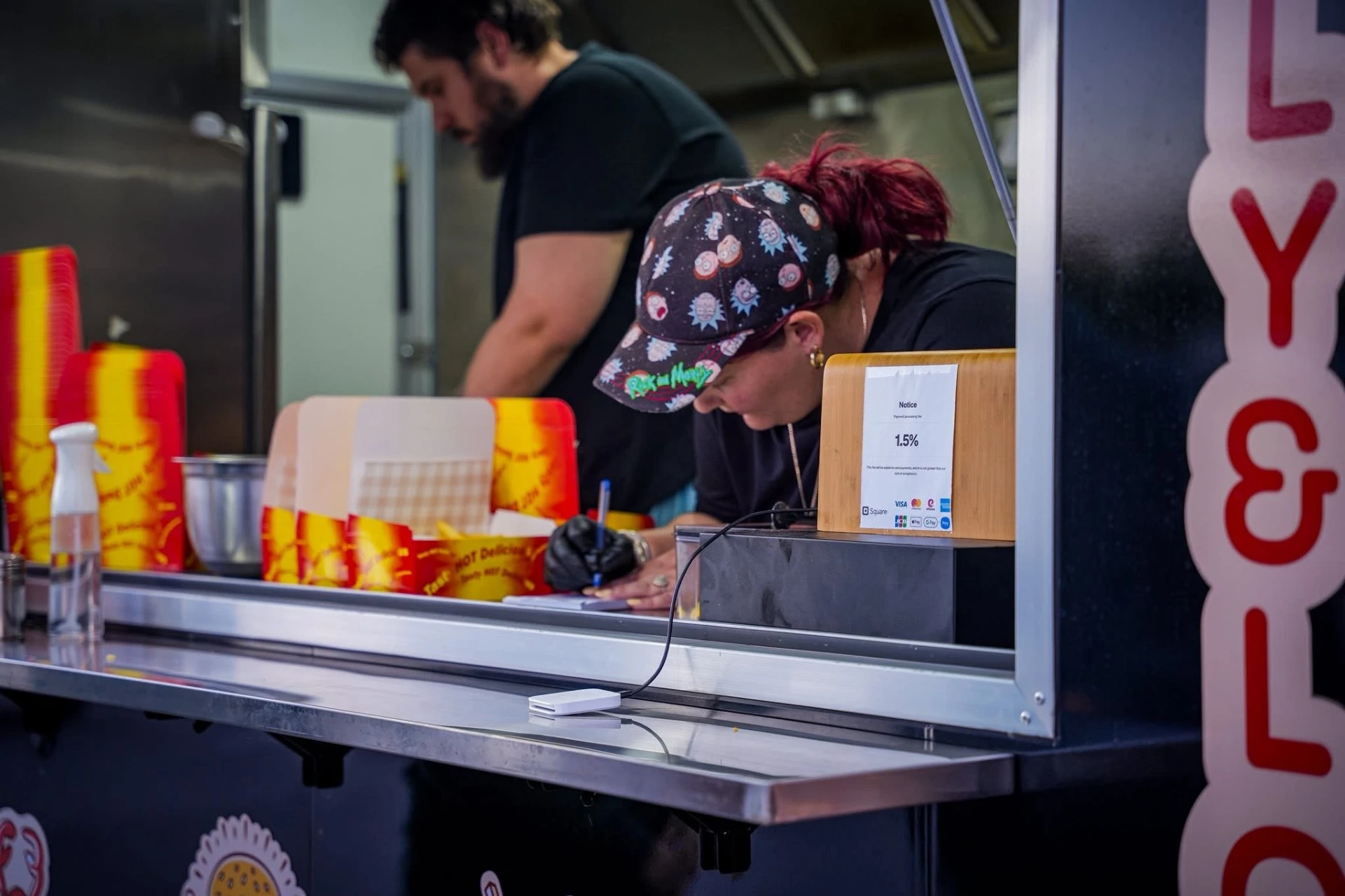 The Mully & Lou's team taking orders inside the van